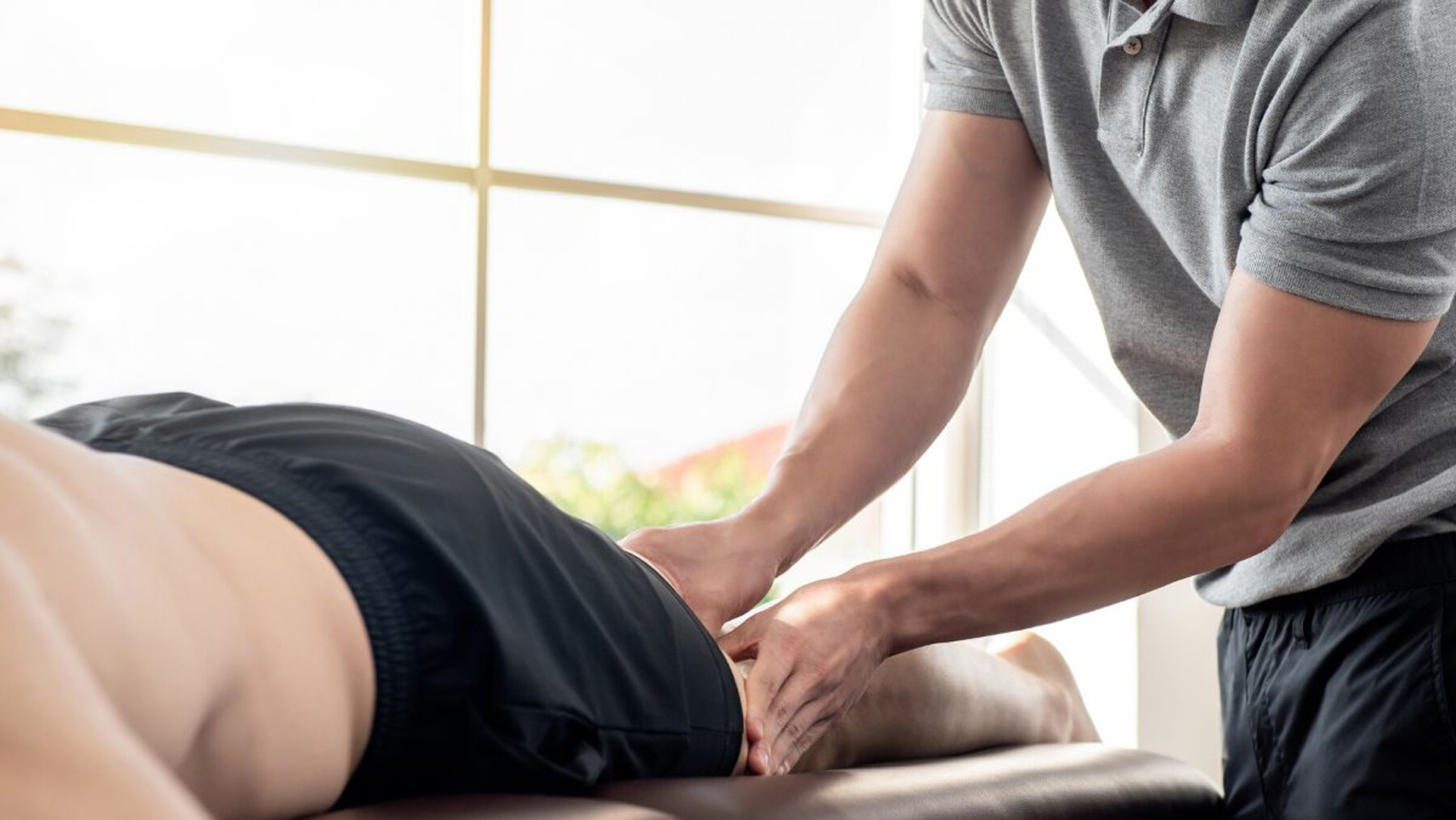 Massage therapist giving patient